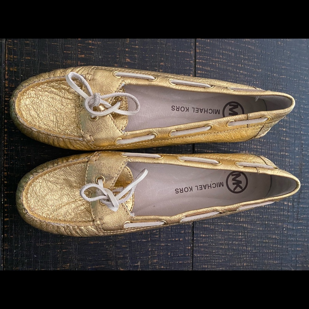 Gold Michael Kors slip on loafers